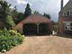 Two Bay Green Oak Fronted Catslide Garage With Integrated Log-store. 5.6m X 5.3m